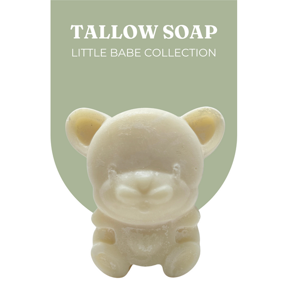 Live Tallowed bear-shaped tallow soap from the Little Babe Collection, made with calendula-infused olive oil. A gentle, all-natural soap designed for delicate and sensitive skin. Displayed against a soft green desert jojoba background with product branding.