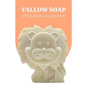 Live Tallowed lion-shaped tallow soap from the Little Babe Collection, made with calendula-infused olive oil. A gentle, all-natural soap designed for delicate and sensitive skin. Displayed against a soft orange background with product branding.