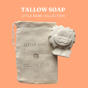 Live Tallowed lion-shaped tallow soap from the Little Babe Collection, made with calendula-infused olive oil. A gentle, all-natural soap designed for delicate and sensitive skin. Displayed against a soft orange background and a natural linen bag with product branding.